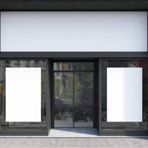 Glass, white and gray stone cafe facade with two vertical posters and a glass door. 3d rendering mock up